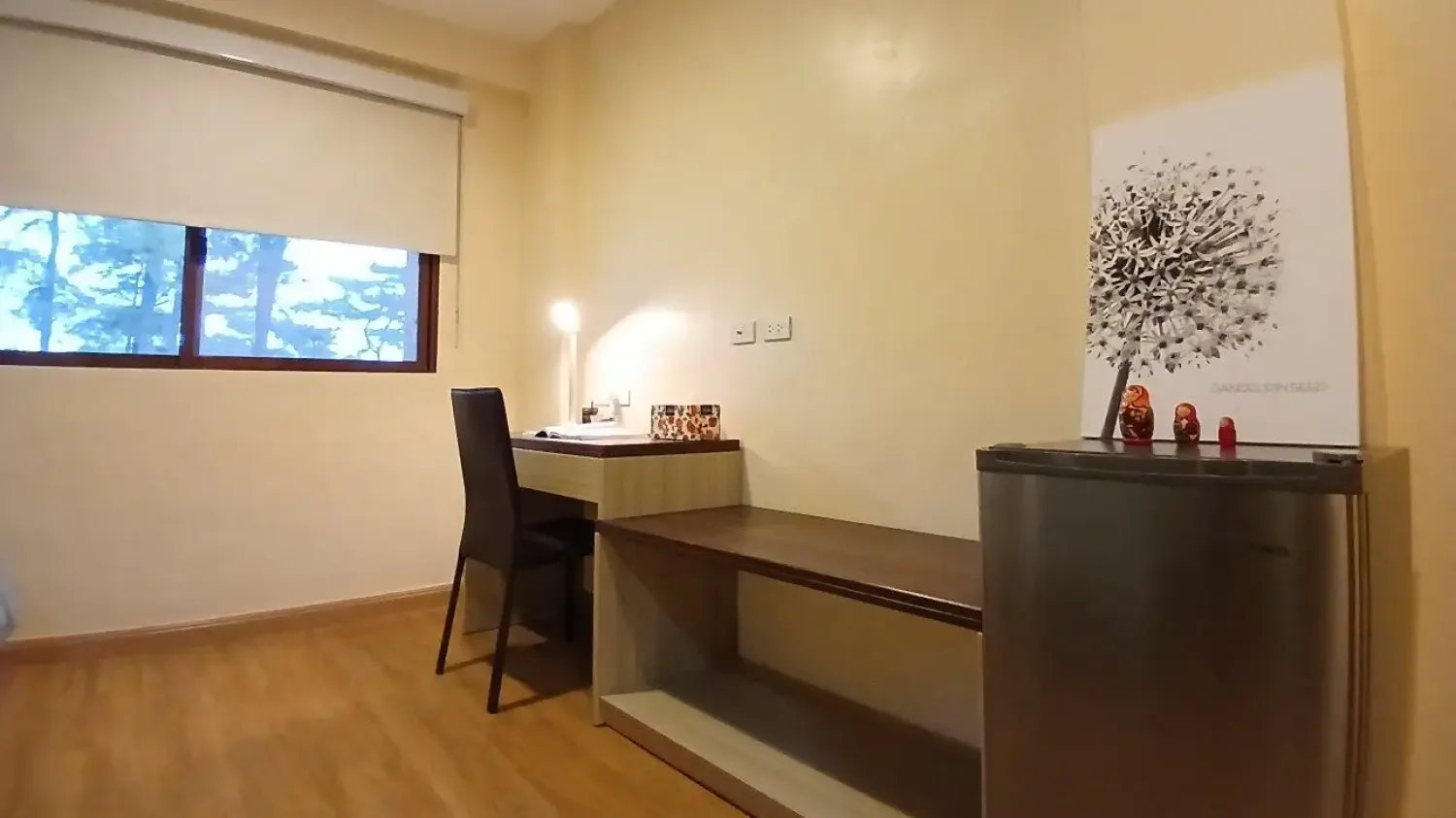 Study desk with lamp and storage in a Premium Single dorm room in Baguio